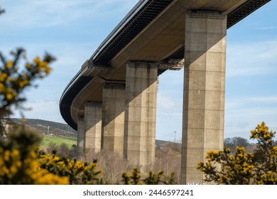 View underneath a bridge. Concrete multi span cable-stayed box girder bridge over an estuary (Erskine Bridge over River Clyde, Glasgow, Scotland) - Powered by Shutterstock