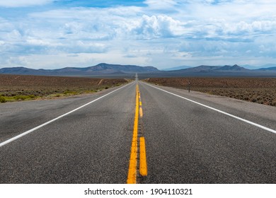 View of the US route 50 (known as the Loneliest Road in America) in the State of Nevada, USA. Concept for travel in America and road trip.
