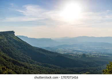 View of Valle de Mena and Valle de Losa, in Burgos, North of Spain. Green valley a sunny day with rugged mountain ridge. Meadows and forests.