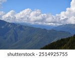 A view of a valley with mountains in the background, featured on flickr, new objectivity, creative commons attribution, panorama