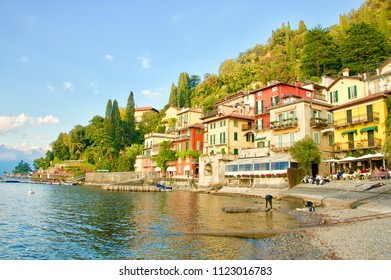 A view of Varenna, a lovely village situated on the eastern shore of Lake Como, in autumn on a late tranquil afternoon, with locals and tourists enjoying the beauty of the scene before them. - Powered by Shutterstock