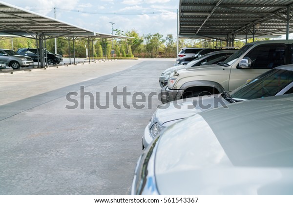 View of\
vehicles parked in car parking lot - Car park\
