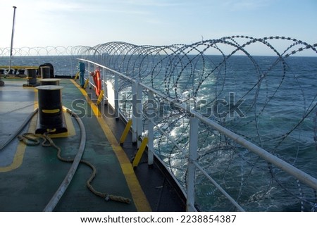 View of the vessel hardening on board a merchant ship using razor wire to stop pirates from boarding the ship. These ship protection measures are employed when the ship passes through high-risk areas