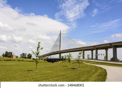 A view of the Veterans' Glass City Skyway bridge in Toledo Ohio.  A beautiful  blue sky with white clouds for a background.