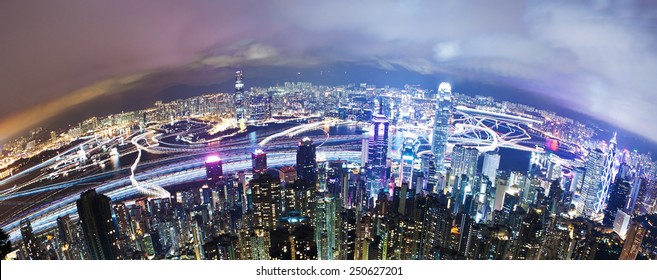 View Of Victoria Harbour In Hong Kong From The Peak, Long Exposure With Light Trails Of Moving Ships