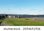 view of the village of arnside from the bank of the river kent with surrounding lakeland scenery