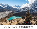 View of Village and Lake Gokyo, snow capped Cholatse, Taboche, Cholatse, Lhotse, Nuptse, Everest, Pumori in the Himalayas and Ngozumpa Glacier. View from Gokyo Ri, Solukhumbu, Sagarmatha, Nepal.