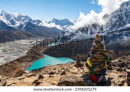 View of Village and Lake Gokyo, snow capped Cholatse, Taboche, Cholatse, Lhotse, Nuptse, Everest, Pumori in the Himalayas and Ngozumpa Glacier. View from Gokyo Ri, Solukhumbu, Sagarmatha, Nepal.