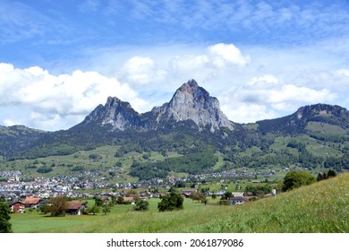 View of the villages Schwyz and Rickenbach with the mountains Grosser Mythen and Kleiner Mythen in the background.