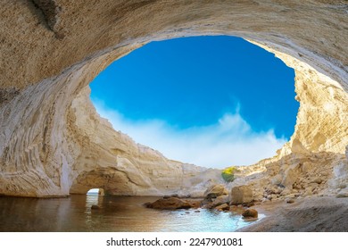 View of the volcanic open cave of Sykia, Milos island, Cyclades, Greece - Shutterstock ID 2247901081