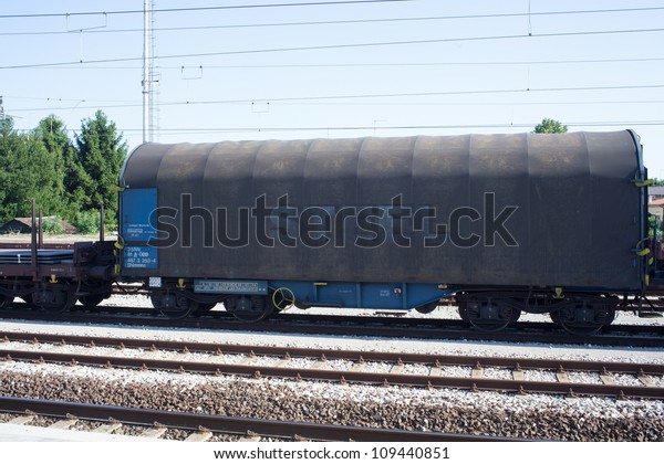 View of a Wagon of\
steel in the railroad