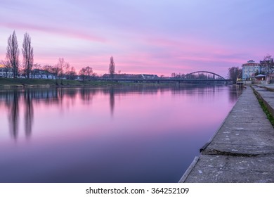 View of Warta river and railway bridge at sunrise in Gorzow, Poland 