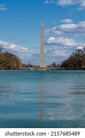 View of Washington Monument on the Reflecting Pool in Washington, DC, USA at dawn. Summer.