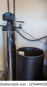 View Of Water Softener And Uncovered Brine Tank