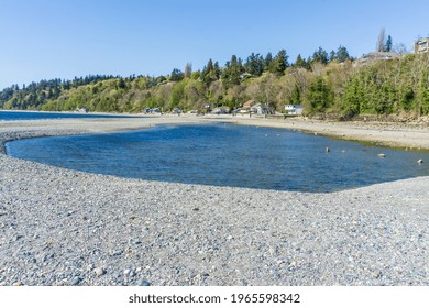 A View Of Waterfront Homes And A Tide Pool In Des Moines, Washington.