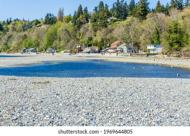 A View Of Waterfront Homes And A Tide Pool In Des Moines, Washington.