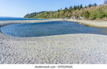 A View Of Waterfront Homes And A Tide Pool In Des Moines, Washington.