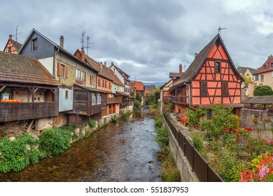 View of Weiss river with historical houses in Kaysersberg, Alsace, France