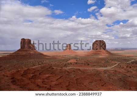 View of the West Mitten Butte, East Mitten Butte and Merrick Butte red sandstone formation in Monument Valley, AZ