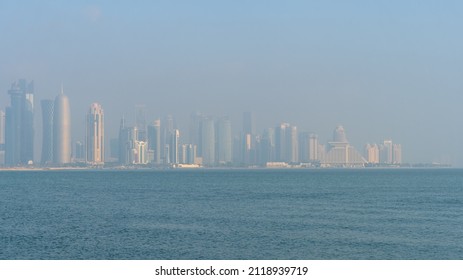 view of Westbay area with many iconic towers and builidings on misty day morning in doha qatar
