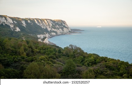 View at white cliffs of Dover, grass, trees and rocks in Southeast Great Britain