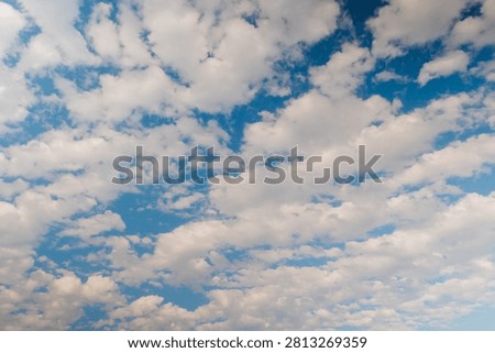 View of white clouds in the blue sky in the afternoon. Daylight, afternoon, cloudy day. Abstract, freedom, nature, peaceful and cloudscape concept