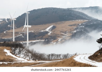 View of the wind turbines on the covered mountain in winter - Powered by Shutterstock