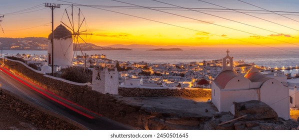 View of the windmills and town from elevated position at dusk, Mykonos Town, Mykonos, Cyclades Islands, Greek Islands, Aegean Sea, Greece, Europe