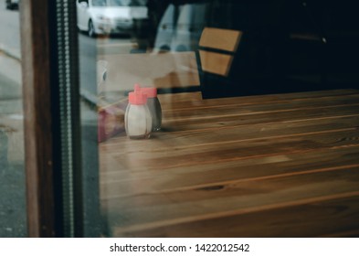 View from the window in the cafe, empty table, salt on the table