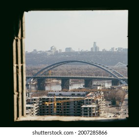 view from the window to the city with a bridge