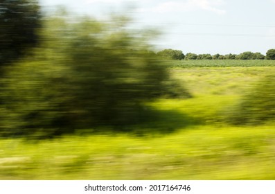 View From The Window Of A Fast Moving Train On Summer Day