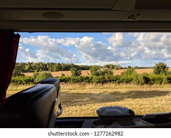 View from the window on beautiful fields while traveling by bus
