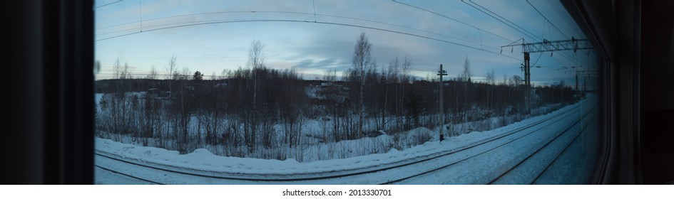 View from the window of the passenger train. winter weather