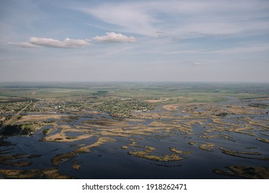 view from the window of a small plane on the city and fields, landscape