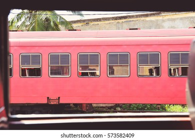 view from the window of a train to another train