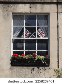 View of a window with union jack flags - Shutterstock ID 2258239401