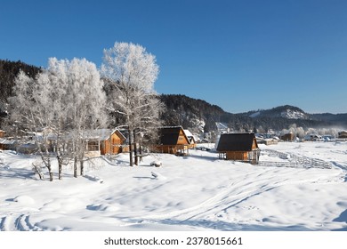 View of the winter Altai, the village of Artybash on the Bank of the Biya river. Altai Republic, Russia