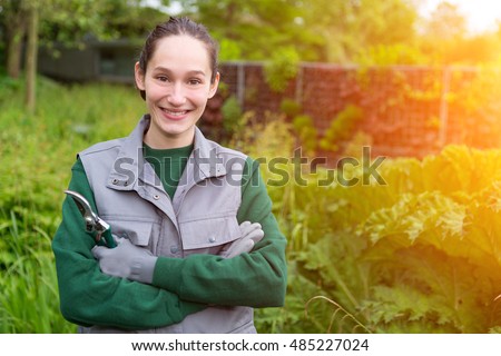 View  of a woman city public worker in a garden