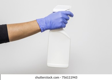 View At Woman Cleaning With Spray Bottle