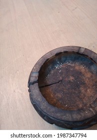 The View Of A Wooden Ashtray From Above Placed On A Wooden Table