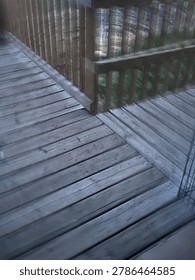View of wooden deck structure showcasing outdoor residential construction, timber surface textures, and backyard exterior design