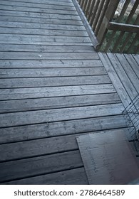 View of wooden deck structure showcasing outdoor residential construction, timber surface textures, and backyard exterior design