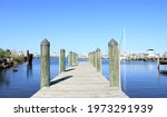 A view of a wooden dock with a blue sky in Gulfport, Mississippi 