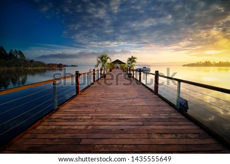 View of the wooden jetty during beautiful sunrise scenary at Bukit Merah, Perak