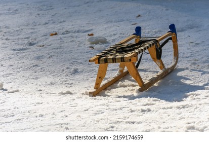 A view of a wooden sled on a snow on a snow