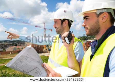 View of a Worker and architect watching some details on a construction