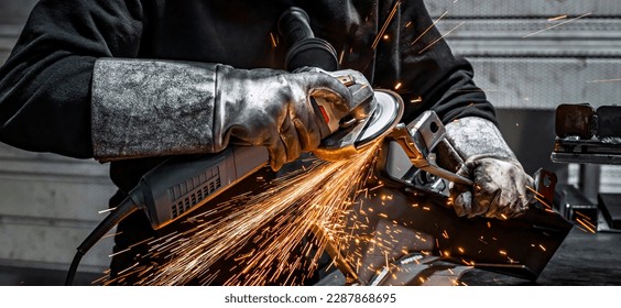 View of worker grinding a piece of metal, France - Powered by Shutterstock