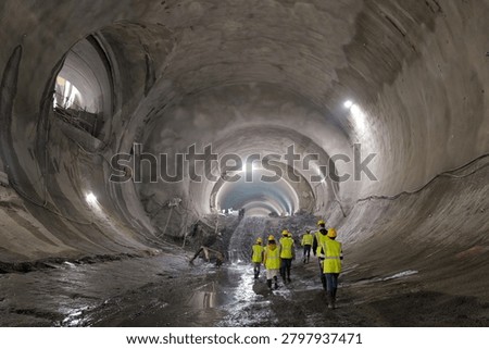 View of workers at the construction site of a subway tunnel under the city