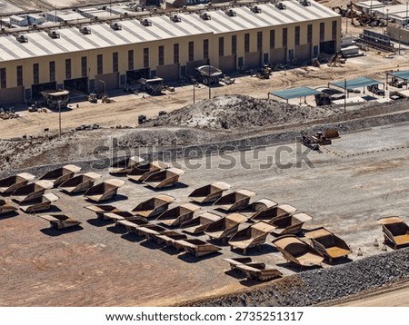 View of a workshop platform with a huge pool of CAEX truck hoppers waiting for repairs