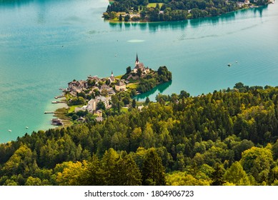 View of the Worthersee lake with Maria Worth church, Carinthia, Austria. Aerial view from pyramidenkogel view tover. Tourist spot